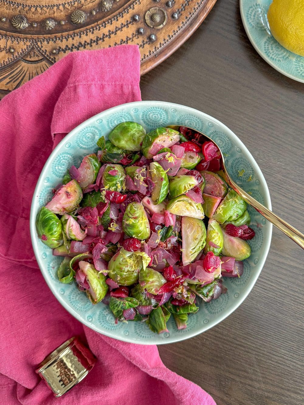 A bowl of Brussels sprouts with cranberries.