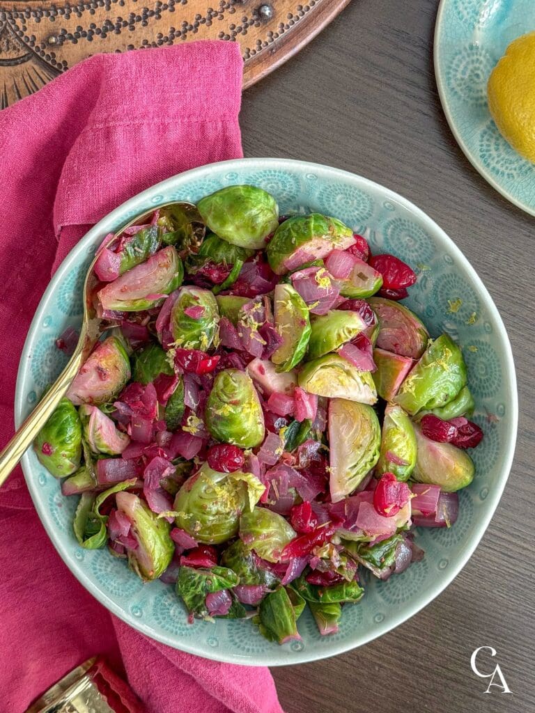 Sautéed Brussels sprouts with cranberries and a lemon.