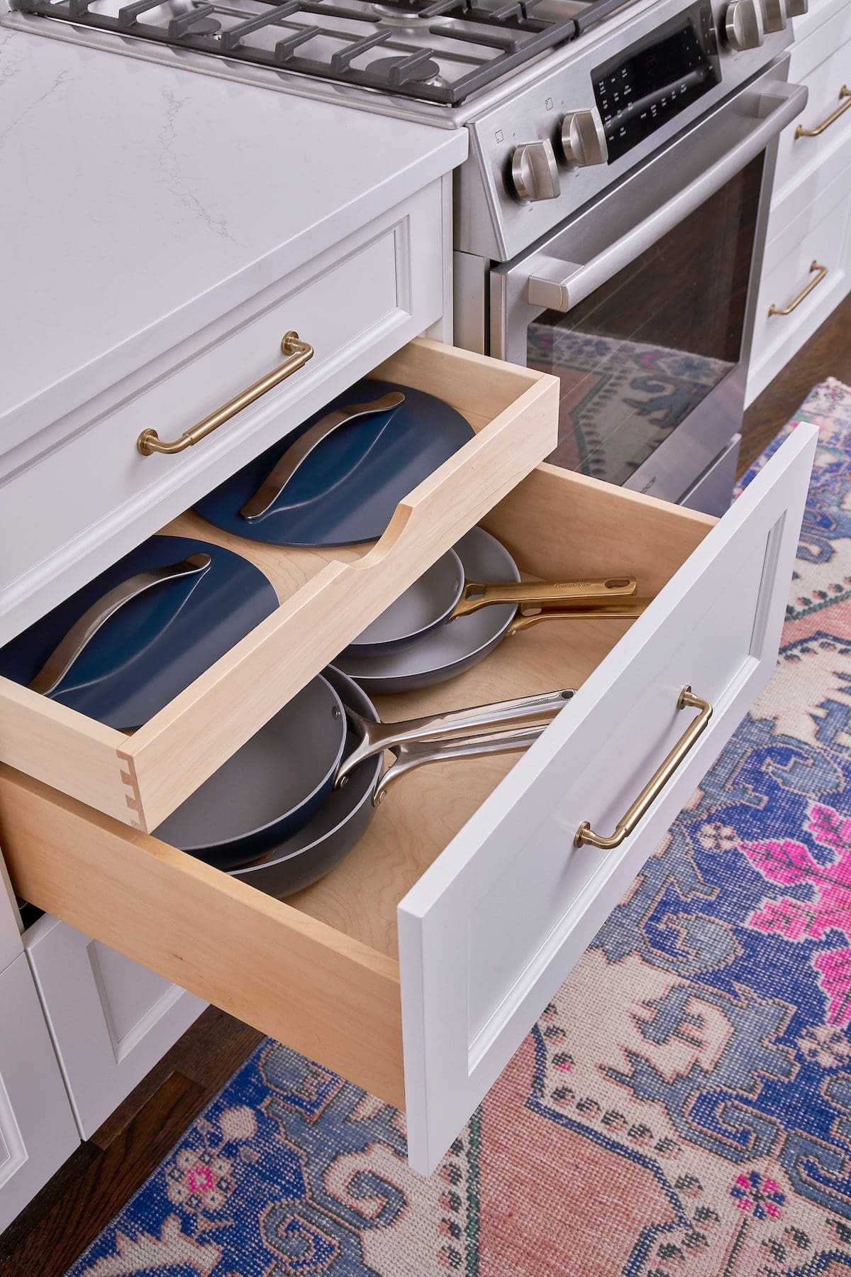 Kitchen drawers with pots and pans.