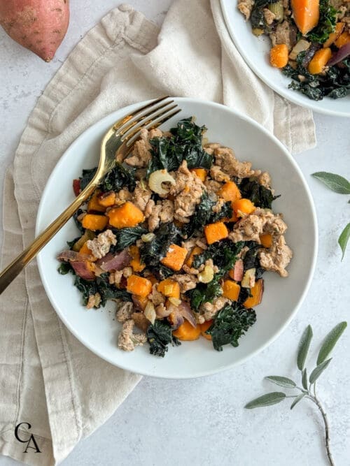 A bowl of ground turkey, sweet potato and kale.