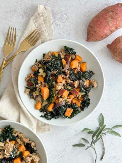 Two bowls of food on a grey countertop.