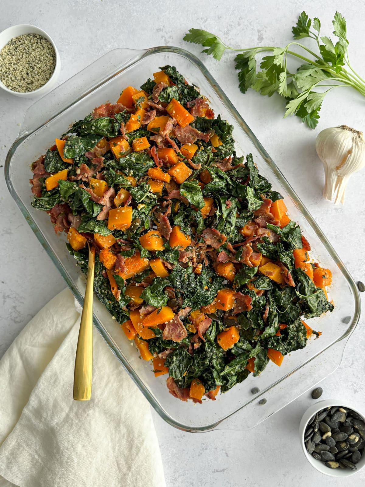 A casserole with kale, squash, and hemp seeds.