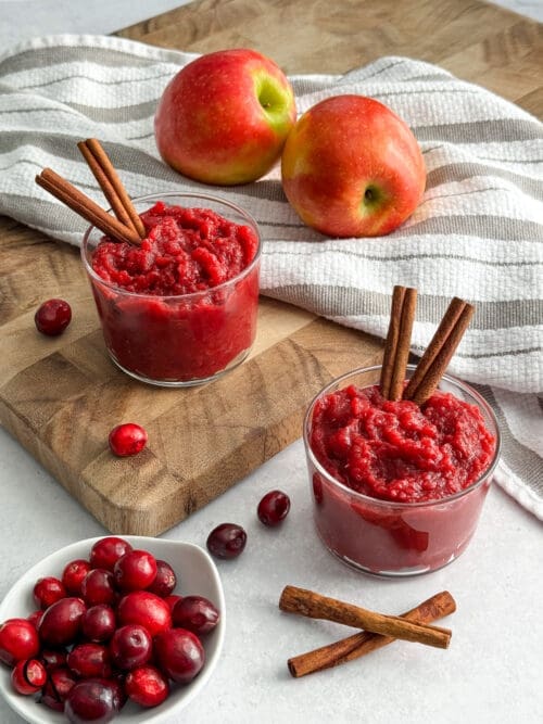 Bowls of unsweetened applesauce with cranberries.