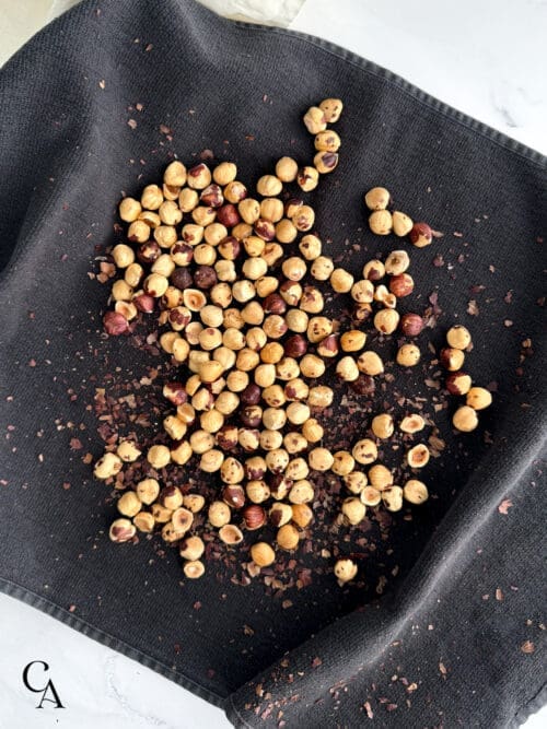 Roasted hazelnuts on a towel.