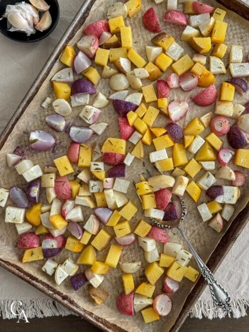 A sheet pan of roasted rutabaga, turnips, and radishes.